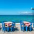 Tables lined up for a seaside taverna