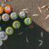 Cans of spray paint of multiple colors on the street